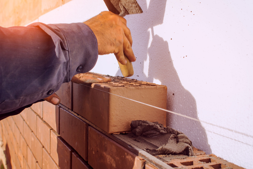 Facing bricklaying construction work, manual labor.